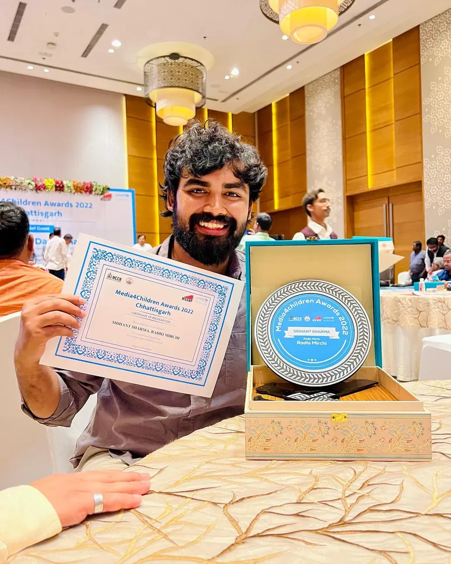 Siddhant Sharma displaying his Media4Children Award certificate and recognition